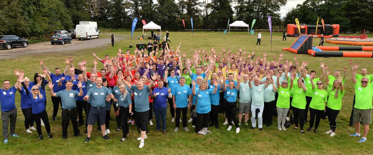 image of group with hands in the air