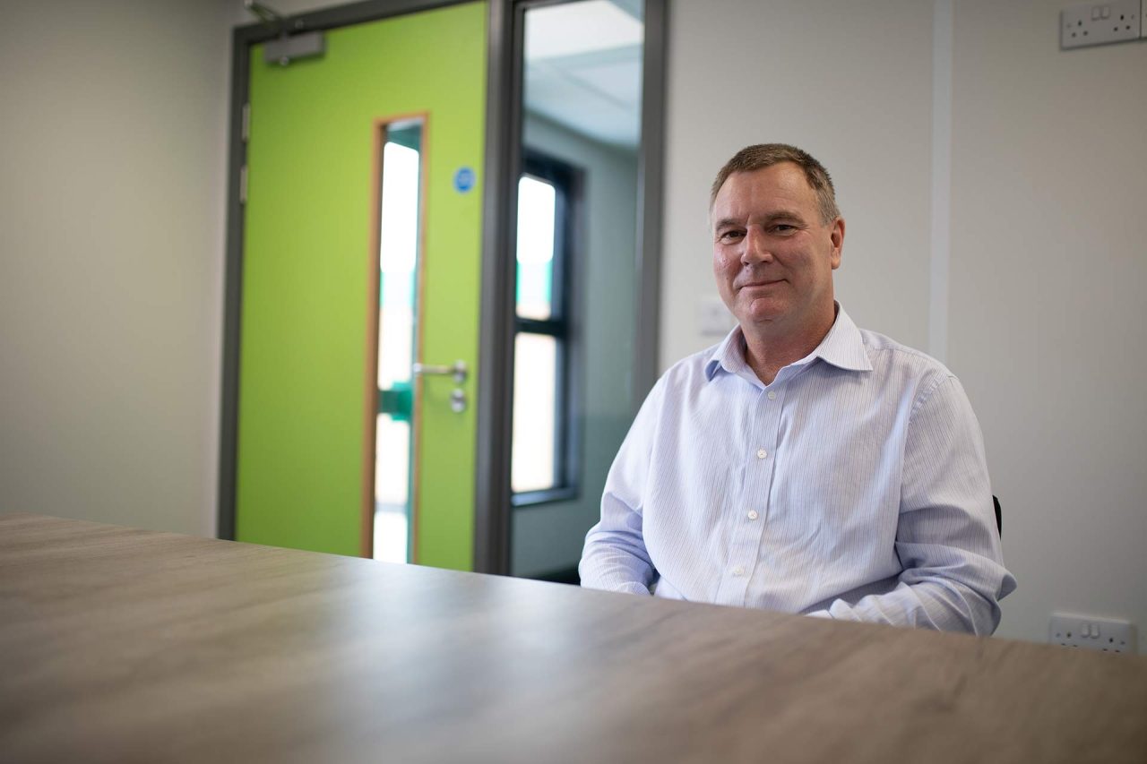 image of director in meeting room