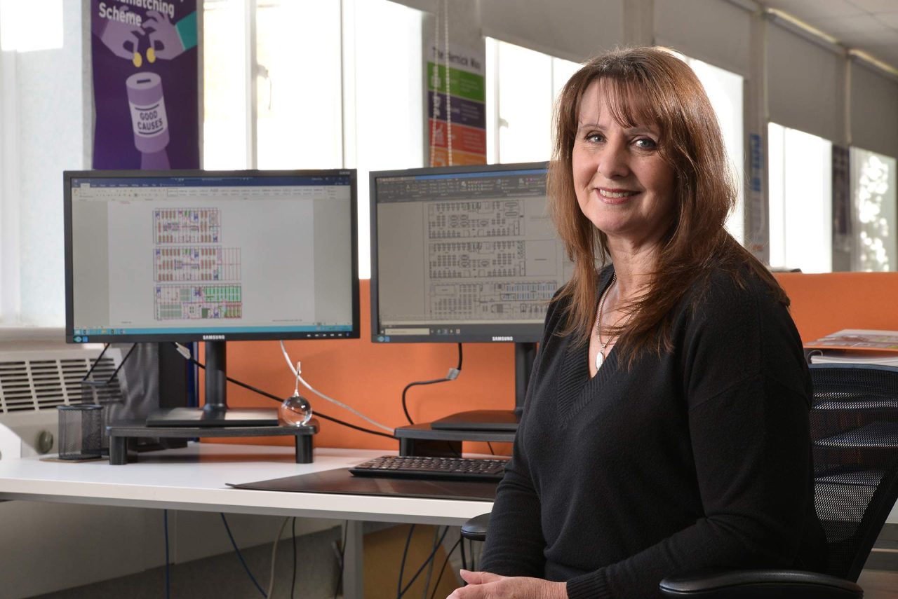 Image of employee at desk