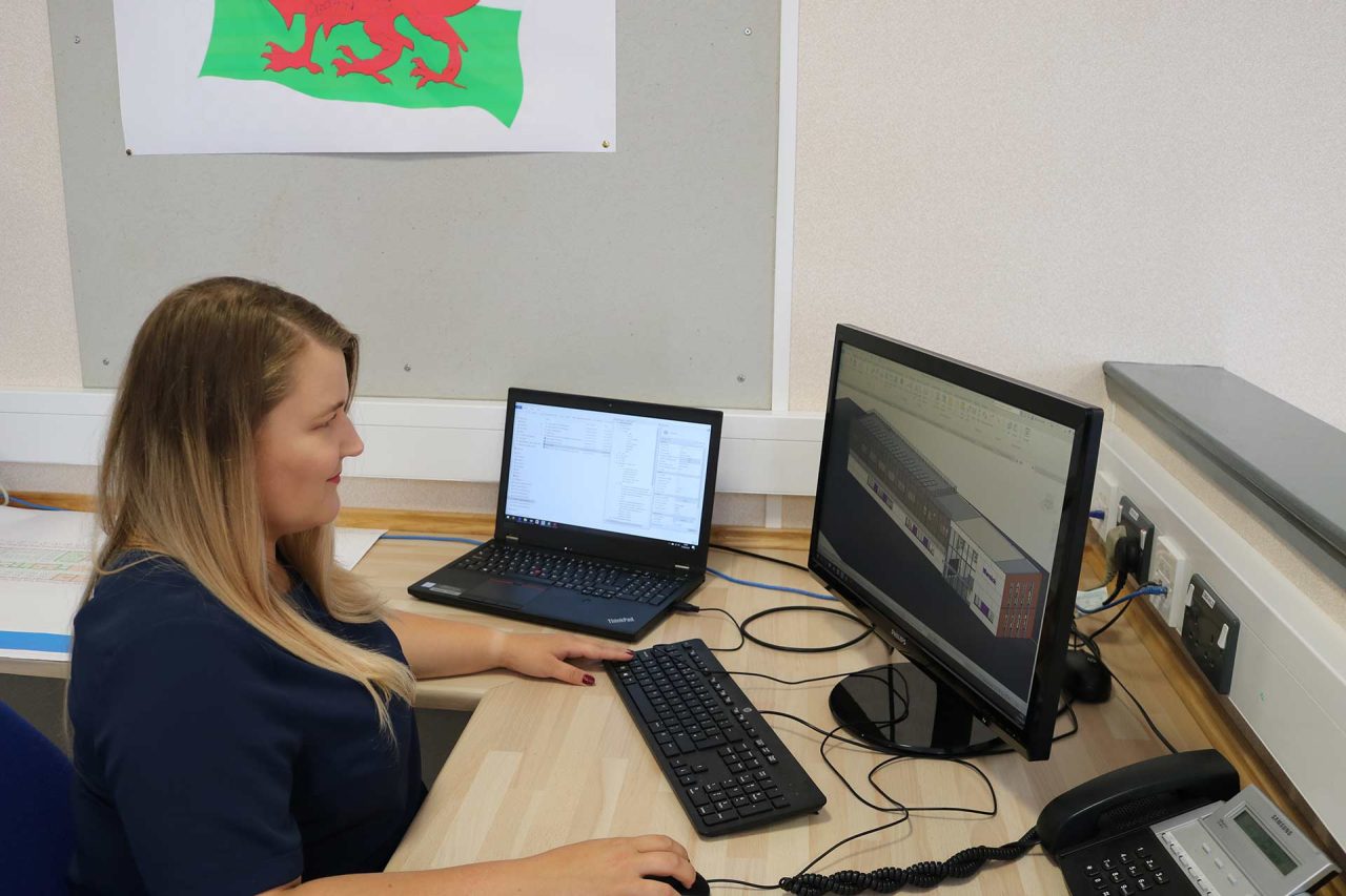 image of employee at desk