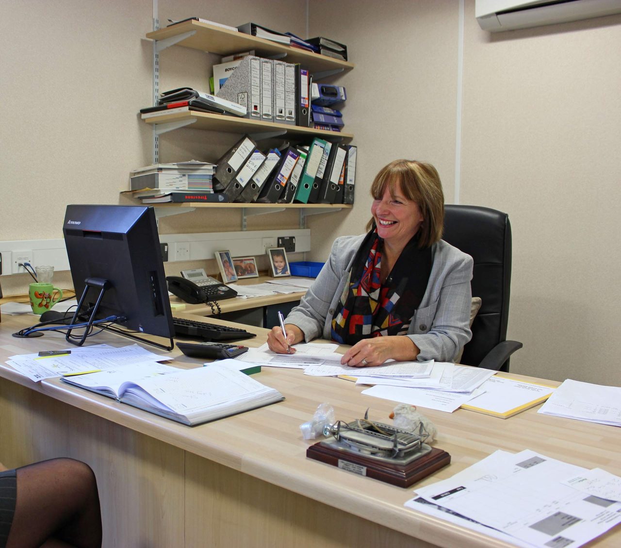 image of employee working at the desk
