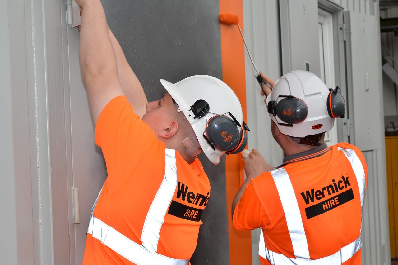 image of two employees working in the yard