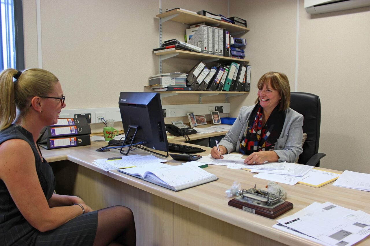 image of two employees talking