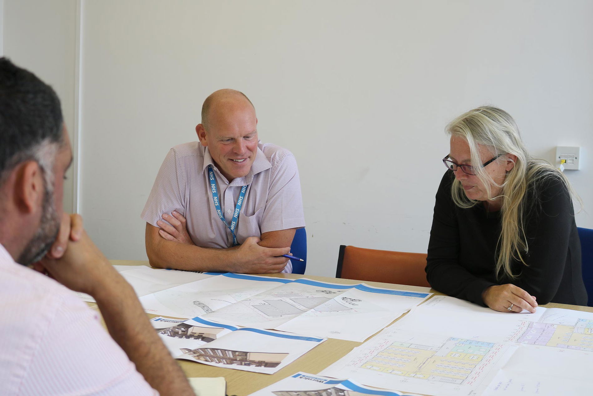 image of clients discussing designs