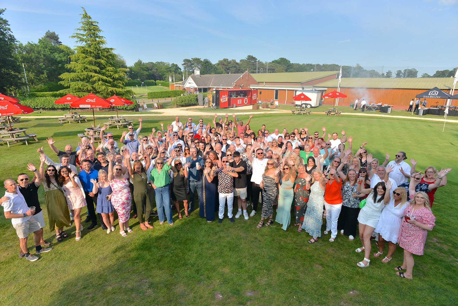 image of employees with hands up
