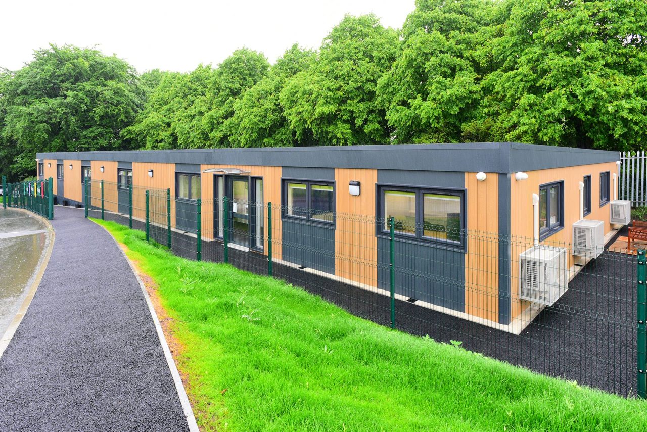 Image of a refurbished modular school classroom block with wood cladding